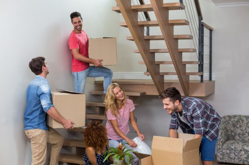 Moving team planning a safe removal with checked equipment and clear access