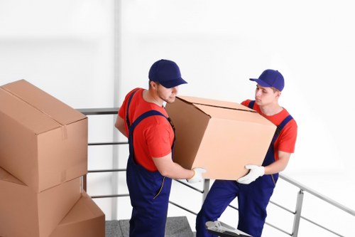 Professional piano movers planning a removal in Colliers Wood