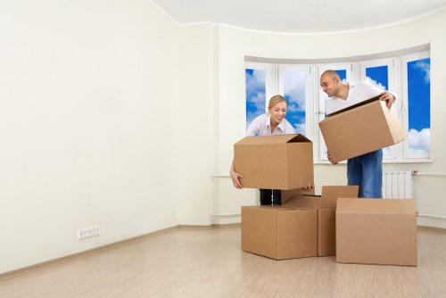 Packed household boxes and furniture prepared for a Colliers Wood move