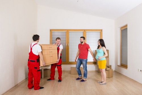 Unpacking household boxes in a new home near Colliers Wood