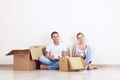 Local office moving team handling furniture and equipment near Colliers Wood