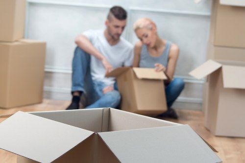 Careful wrapping and organising fragile items during a local home move