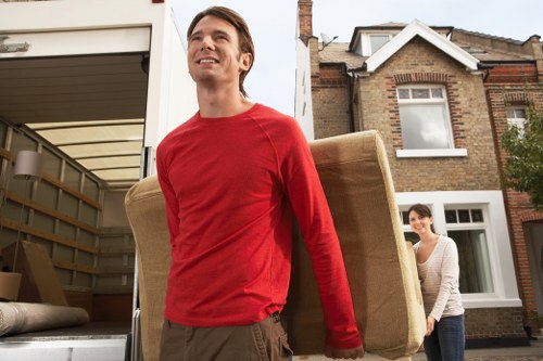 Commercial items being moved by a man with van in Colliers Wood