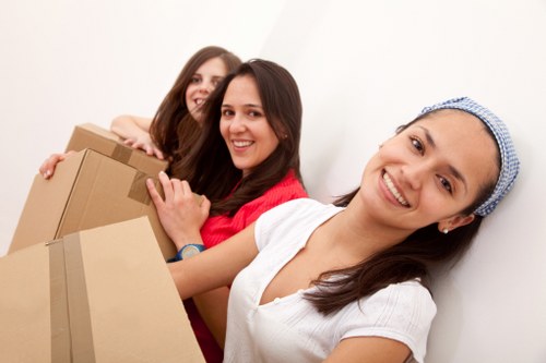 Urgent removals team loading boxes and household items