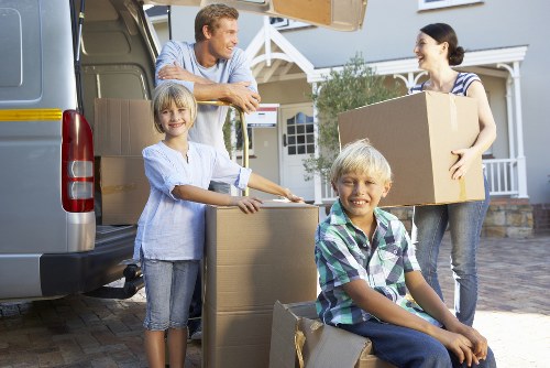 Careful transport of student belongings and packed boxes for a move in Colliers Wood