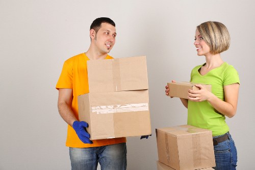 Professional movers packing a room in a Colliers Wood property
