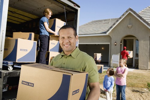 Packed boxes and furniture ready for local storage