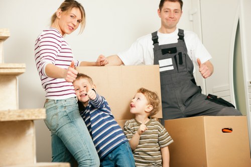 Packed boxes and furniture prepared for a Colliers Wood move
